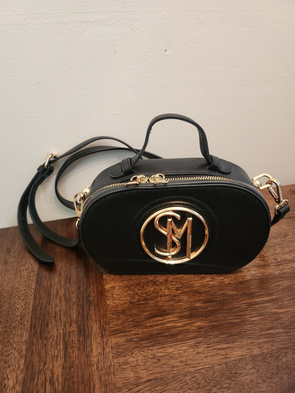 Steve Madden Black Crossbody Camera Bag with Gold Logo Accent